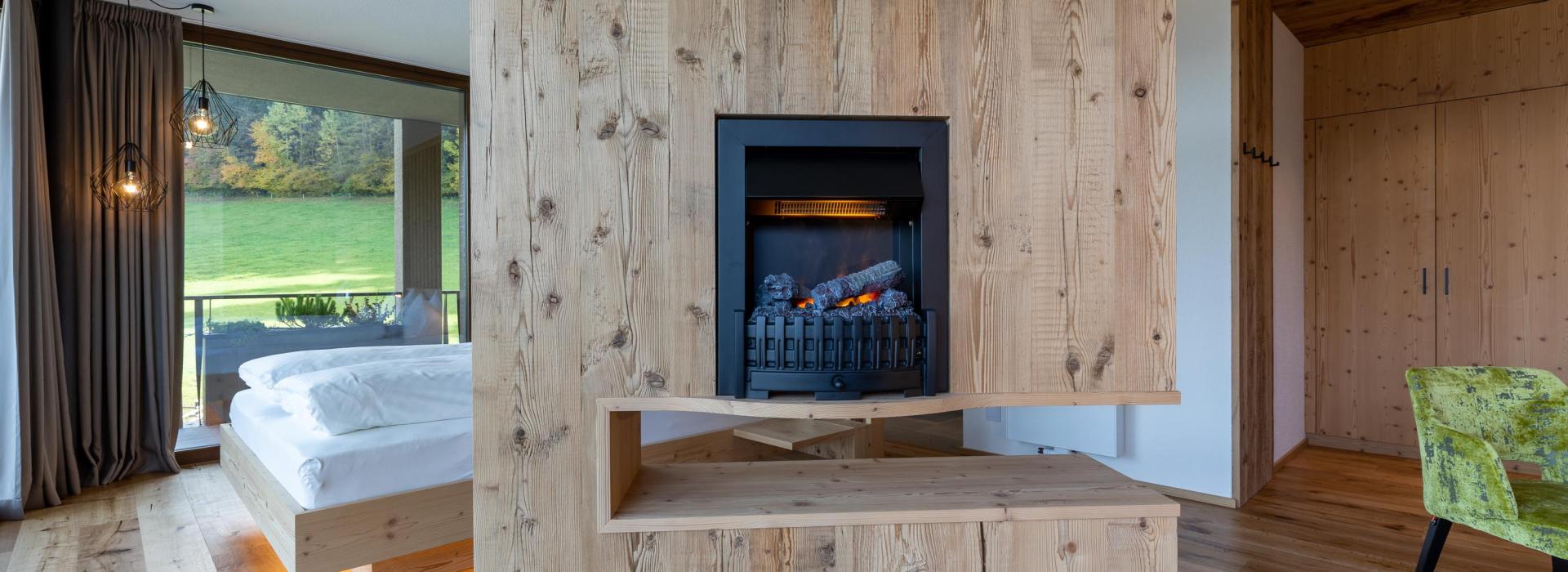 A fireplace in a suite