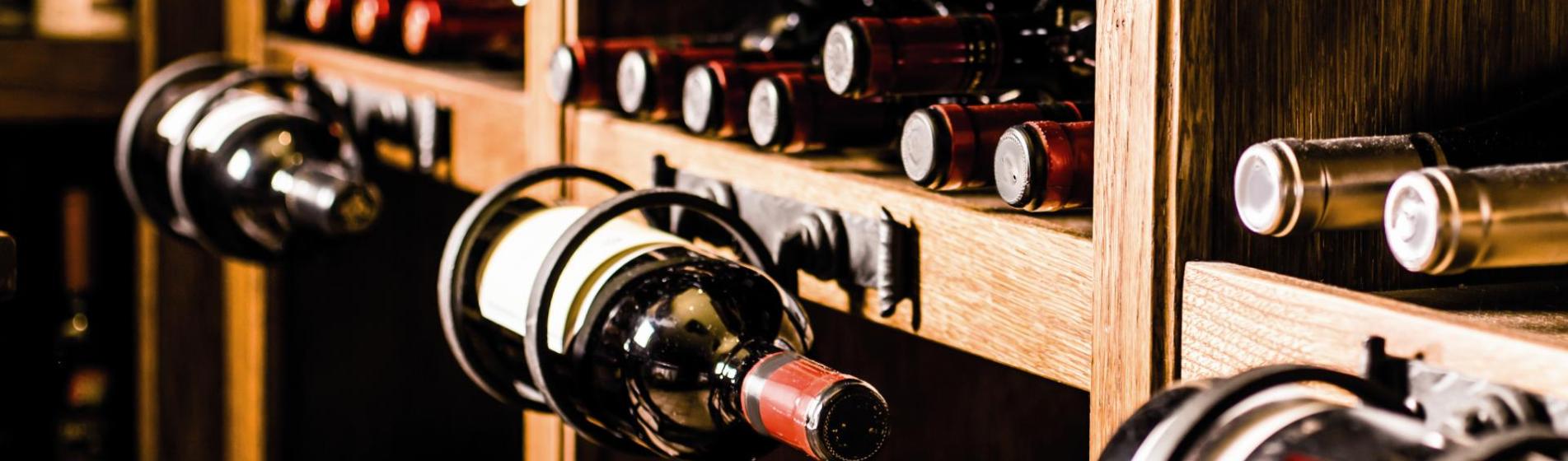 A shelf with wine bottles