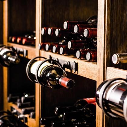 A shelf with wine bottles