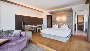 Romantic Suite with a double bed and a sofa